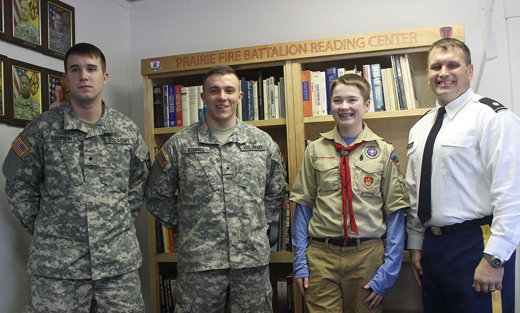 Boy Scout presents ROTC program with custom bookcase