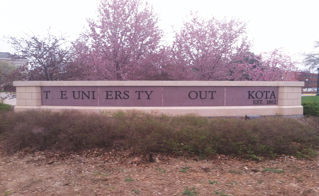 University sign vandalized, search for letters continues