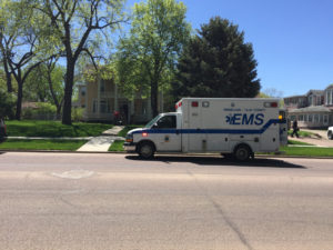 An ambulance sits on the street by USD President Jim Abbott and his wife Collette’s house Wednesday afternoon. Malachi Petersen / The Volante